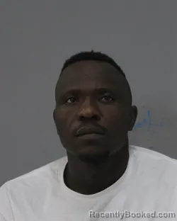 Mugshot of SEVERIN HESSOU ADOUENOU booked in Charles City County, Virginia on March 12, 2026