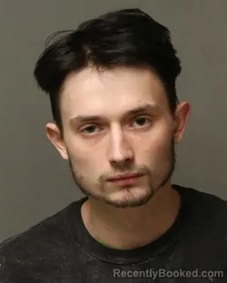 Mugshot of AUSTIN JAMES REYNOLDS