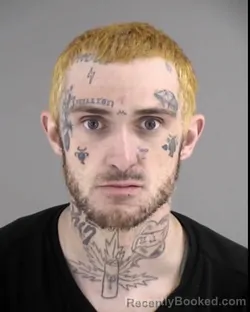 Mugshot of JORDAN CHASE MARKHAM booked in Henrico County, Virginia on March 7, 2026