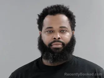 Mugshot of MIQUEL DIMARCUS OLIVIS booked in Henrico County, Virginia on July 11, 2026