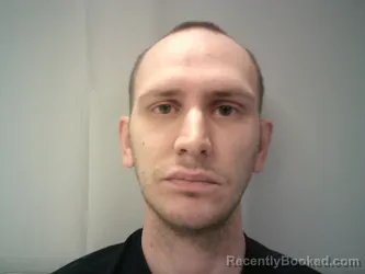 Mugshot of Justin Michael Bomer