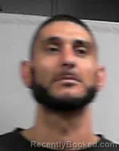 Mugshot of Hassan Adnan Assi booked in Cabell County, West Virginia on May 8, 2026