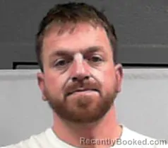 Mugshot of Justin L Wolfe