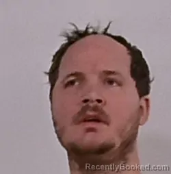 Mugshot of Erik Myles Roomsburg