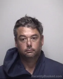 Mugshot of JUSTIN LEE WAINSCOTT