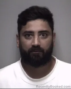 Mugshot of BUNSI JAYESH AMIN booked in Galveston County, Texas on May 3, 2026