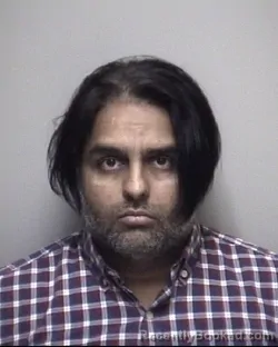 Mugshot of JISAN KARIMALI MAKANOJIYA booked in Galveston County, Texas on May 6, 2026