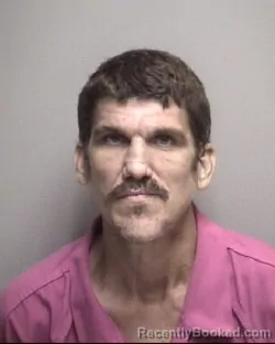 Mugshot of NATHAN EDWARD BURNS booked in Galveston County, Texas on May 7, 2026