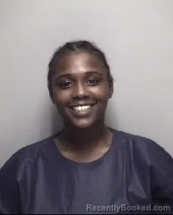 Mugshot of LATIERRA RENASHA MOORE booked in Galveston County, Texas on May 18, 2026