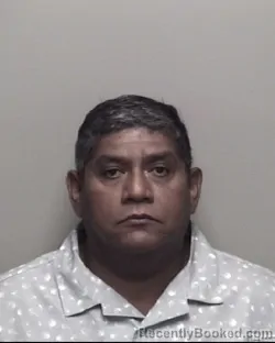 Mugshot of JUAN CARLOS ROMAN booked in Galveston County, Texas on June 28, 2026