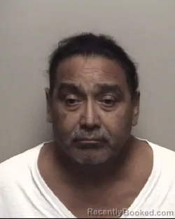 Mugshot of ROLANDO ALBERTO RIVAS booked in Galveston County, Texas on July 14, 2026