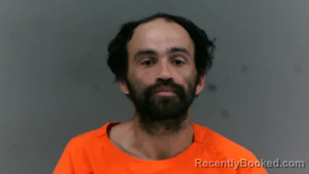 Mugshot of Santo Adam Ayala booked in Logan County, West Virginia on May 21, 2026