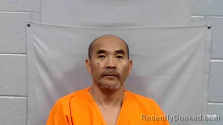 Mugshot of Ren Xin Huang booked in Mercer County, West Virginia on June 19, 2026