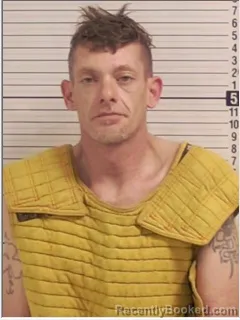Mugshot of JUSTIN NATHANIAL TRAYNOR