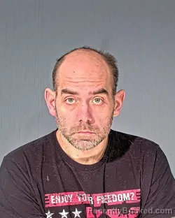 Mugshot of JOHN MICHAEL BUECHNER