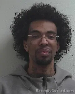 Mugshot of TQUAN C MOORE