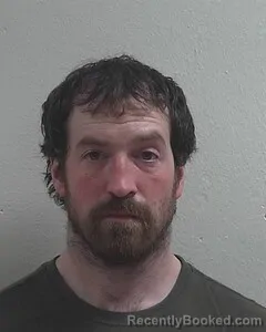 Mugshot of BENJAMIN J PUVOGEL