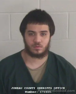 Mugshot of ALFONSO DE JESUS FLORES booked in Juneau County, Wisconsin on March 10, 2026