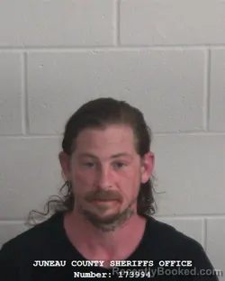 Mugshot of Corey M De Cola