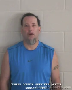 Mugshot of TOMMY LEE WARNER booked in Juneau County, Wisconsin on April 22, 2026