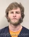Mugshot of JUSTIN MICHAEL FEUKER booked in Kenosha County, Wisconsin on April 10, 2026