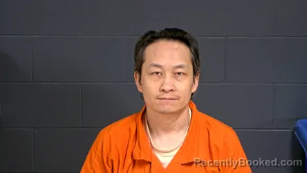 Mugshot of Saint-Luke Blia Xang Her booked in Oconto County, Wisconsin on July 29, 2026