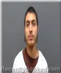 Mugshot of Adrian Contreras booked in Racine County, Wisconsin on August 18, 2026