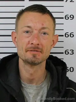 Mugshot of JUSTIN LEWIS GARLAND booked in Carter County, Tennessee on March 19, 2026