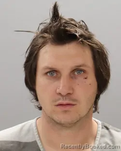 Mugshot of TRAVIS MATTHEW WEAVER