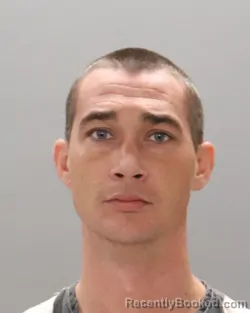 Mugshot of RAYMOND ROMINES