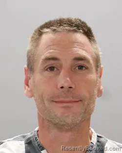 Mugshot of THOMAS KIRK REYNOLDS