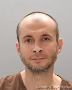 Mugshot of SOSLAN TMENOV booked in Knox County, Tennessee on June 28, 2026