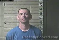 Mugshot of JUSTIN AARON LEE GARLAND booked in Lawrence County, Tennessee on May 20, 2026