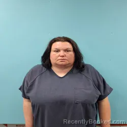 Mugshot of CAROLINE MARION NICOLE MCDAVID booked in Roane County, Tennessee on May 12, 2026