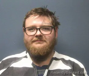 Mugshot of AUSTIN JAMES REYNOLDS