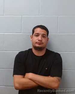 Mugshot of Patrick Elliott Delarosa booked in Hays County, Texas on April 5, 2026