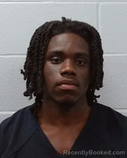 Mugshot of Ackah Derek Aidoo booked in Hays County, Texas on April 5, 2026