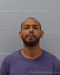 Mugshot of Raymond Alexander Aguilar booked in Hays County, Texas on April 18, 2026