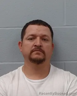 Mugshot of Gustavo Corona Vasquez booked in Hays County, Texas on April 27, 2026