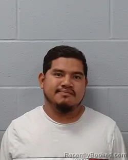 Mugshot of Alex Mendoza Garcia booked in Hays County, Texas on May 4, 2026