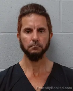 Mugshot of David Allan Davidson booked in Hays County, Texas on May 5, 2026