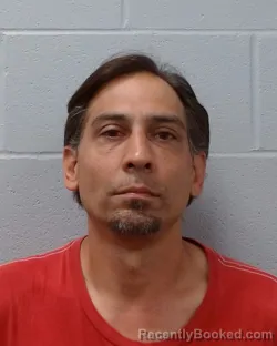Mugshot of Bezhan Nicholas Bahrami booked in Hays County, Texas on May 6, 2026