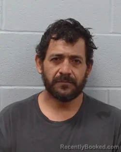 Mugshot of Jose Benedito Madrigales Coto booked in Hays County, Texas on May 7, 2026