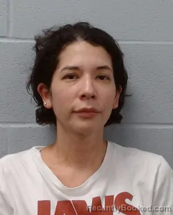 Mugshot of Esperanza Christina Calderon booked in Hays County, Texas on June 19, 2026