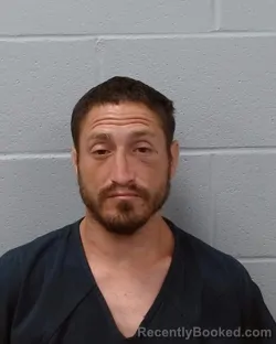 Mugshot of Eric Bustamante booked in Hays County, Texas on June 23, 2026