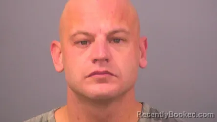 Mugshot of JUSTIN TYLER KAMANDAT