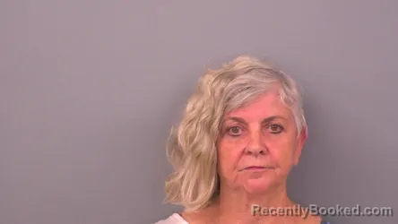 Mugshot of Enid Reine Humeny