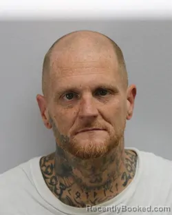 Mugshot of JUSTIN KEITH ROOS