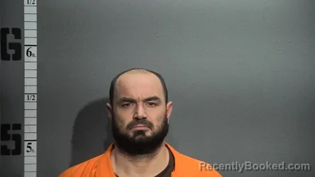 Mugshot of JOHN LEWIS ASTON booked in Suffolk County, Virginia on March 10, 2026