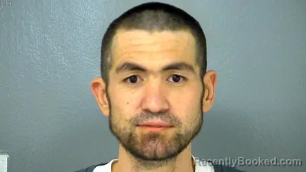 Mugshot of TULKIN KURBONOV booked in Williamsburg County, Virginia on June 17, 2026